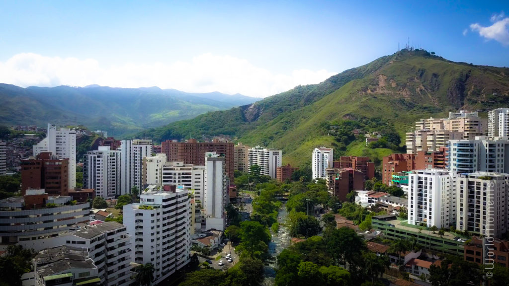 cali tres cruces mountain with city and river drone view